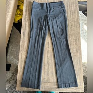 Slightly worn grey slacks